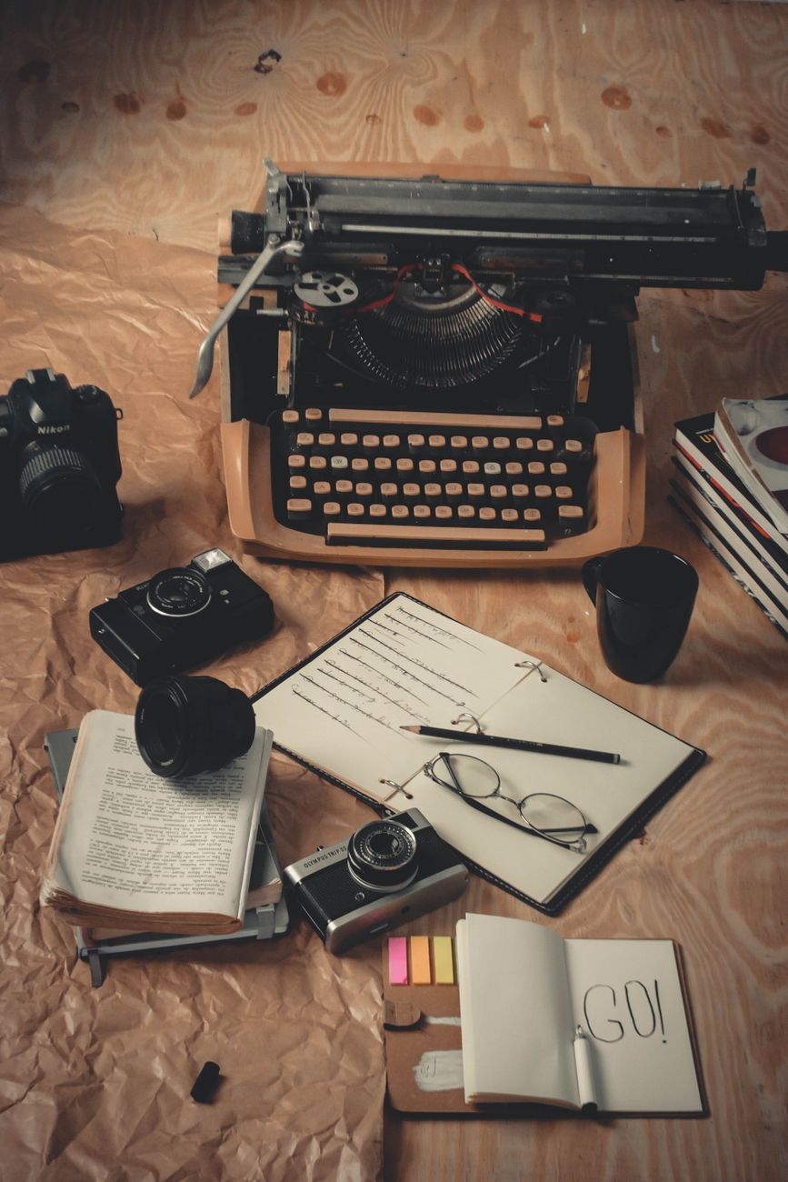 Vintage typewriter with travel journal notes